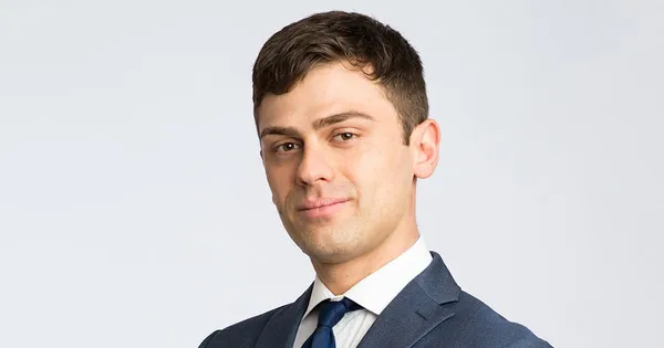 Side profile of a man in a suit