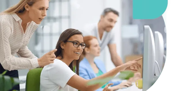 image of persons looking towards screen