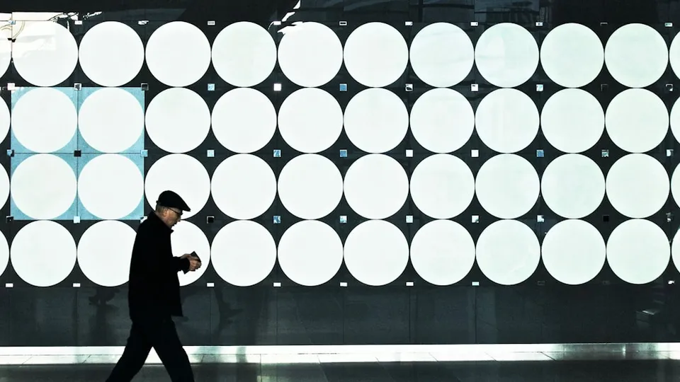 man walking near lights