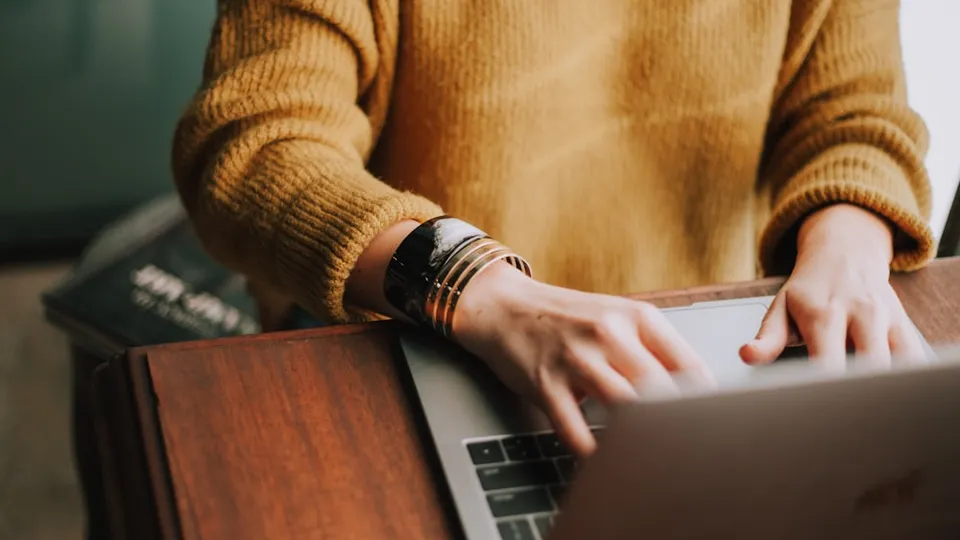 person using laptop computer
